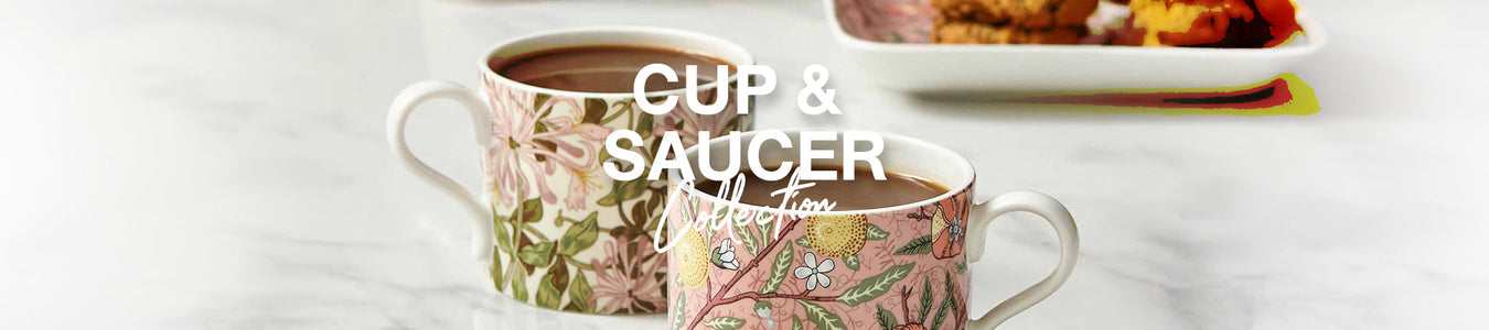 Spode transferware dinnerware set with black and white scenic patterns featuring ornate floral borders, elegantly displayed with vintage glassware and candlelight